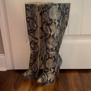 Snake skin knee high heeled boots